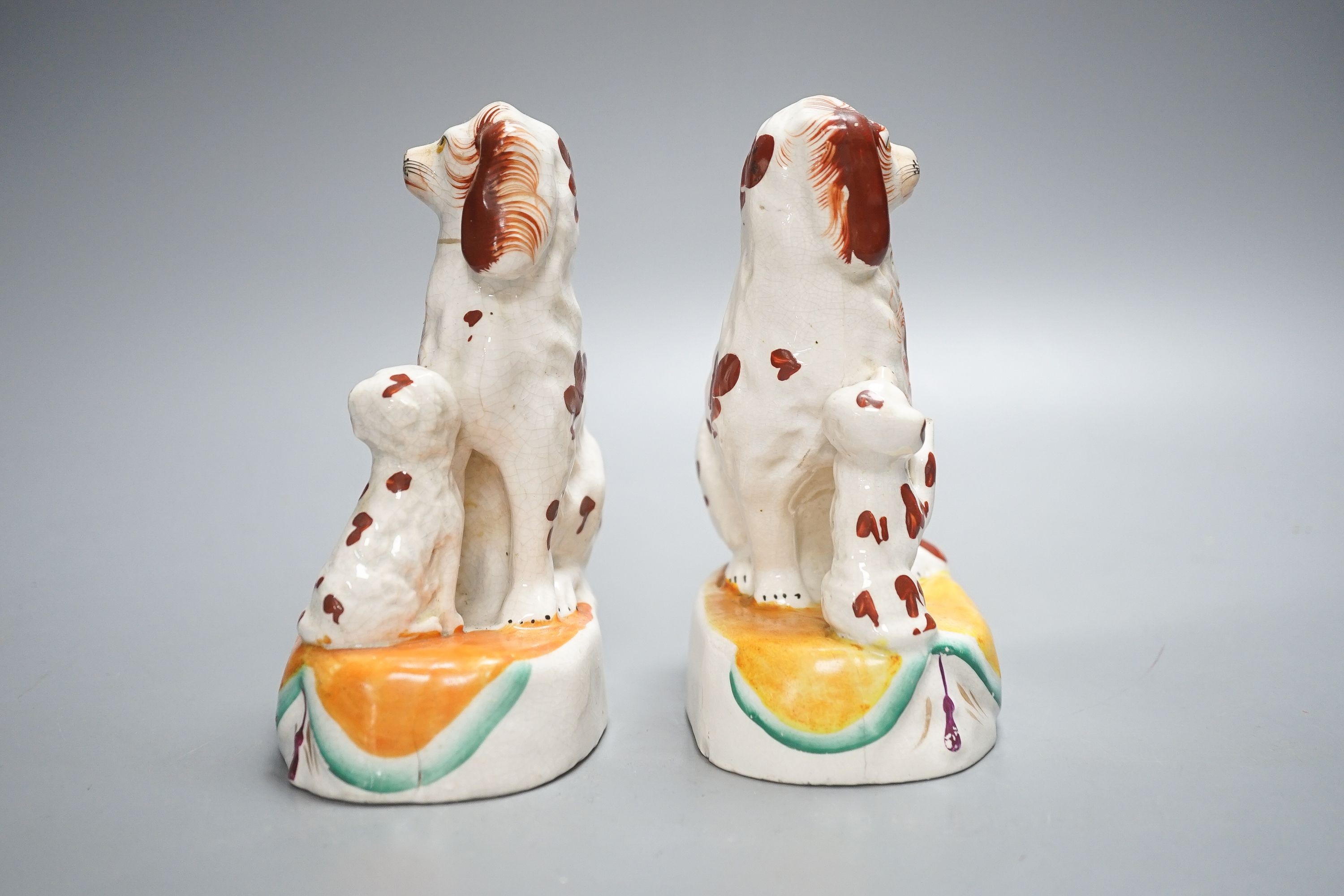 A pair of Staffordshire spaniel and puppy groups, 15cm high